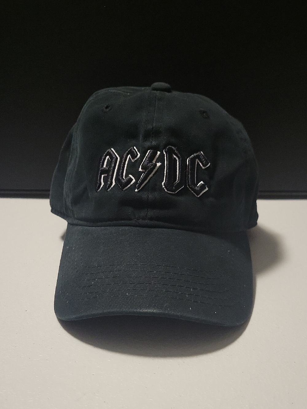 AC/DC Black Baseball Cap with White Embroidered Logo.    10